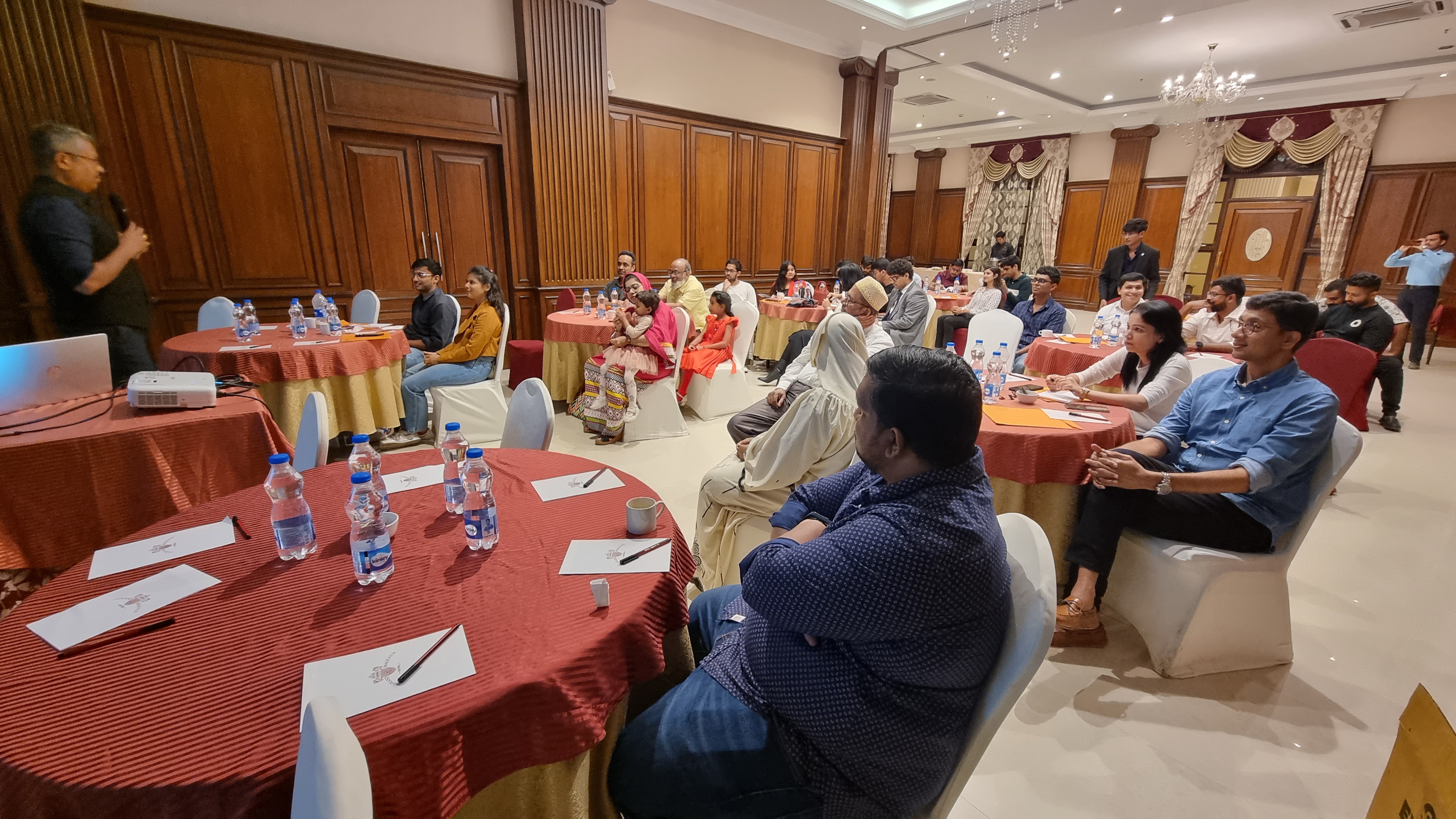 Attendees listening at the investor awareness program